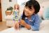 Mattel Mattel Barbie s Downovým syndrómom - šaty s modrými a žltými kvetinami